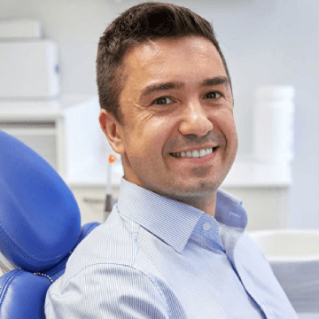 man-smiling-dentures-treatment